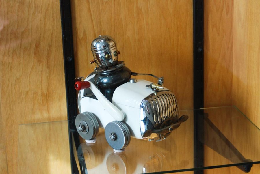 A sculpture of a robot driving a car is on display in the Dave Coyle exhibit at the Neill Public Library. 