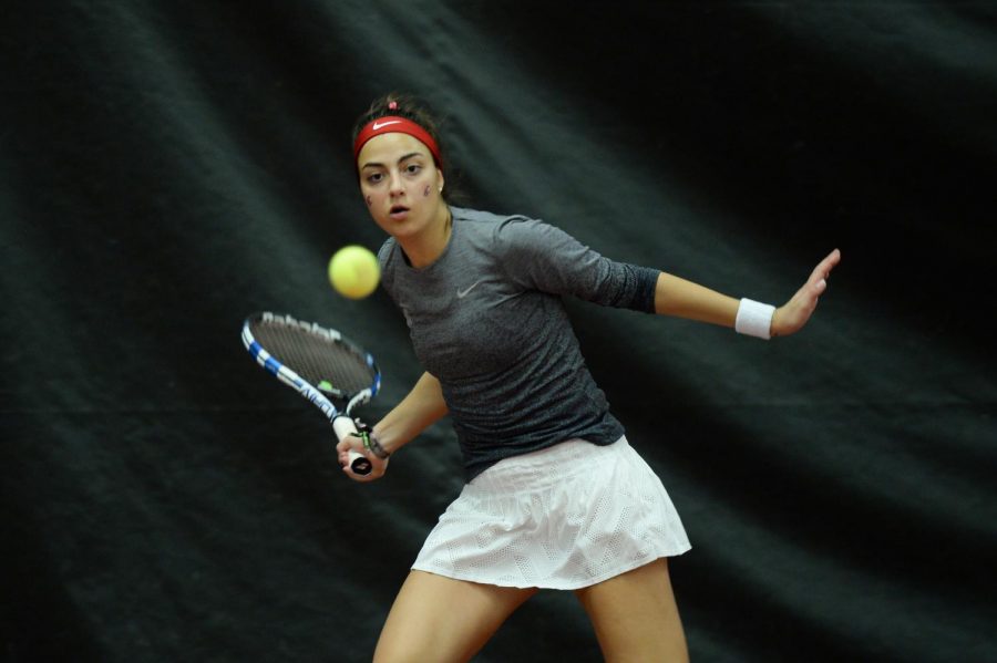 Senior+Tiffany+Mylonas+returns+a+ball+during+doubles+play+against+Seattle+on+Feb.+22+in+Hollingbery+Fieldhouse.