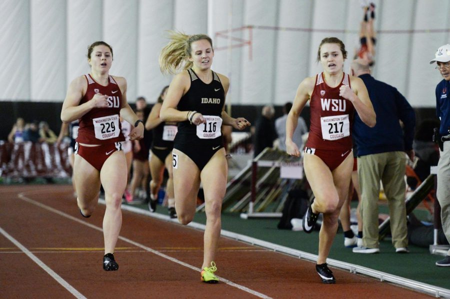 Freshman Ronna Iverson, far right, leads the 400-meter dash followed by Idaho’s Lauren Paven and WSU’s freshman Kristina Schreiber during the WSU Indoor meet Jan. 19 at the Indoor Practice Facility. Iverson placed first in the event with a time of 59.21; Schreiber placed second with a time of 59.42. 