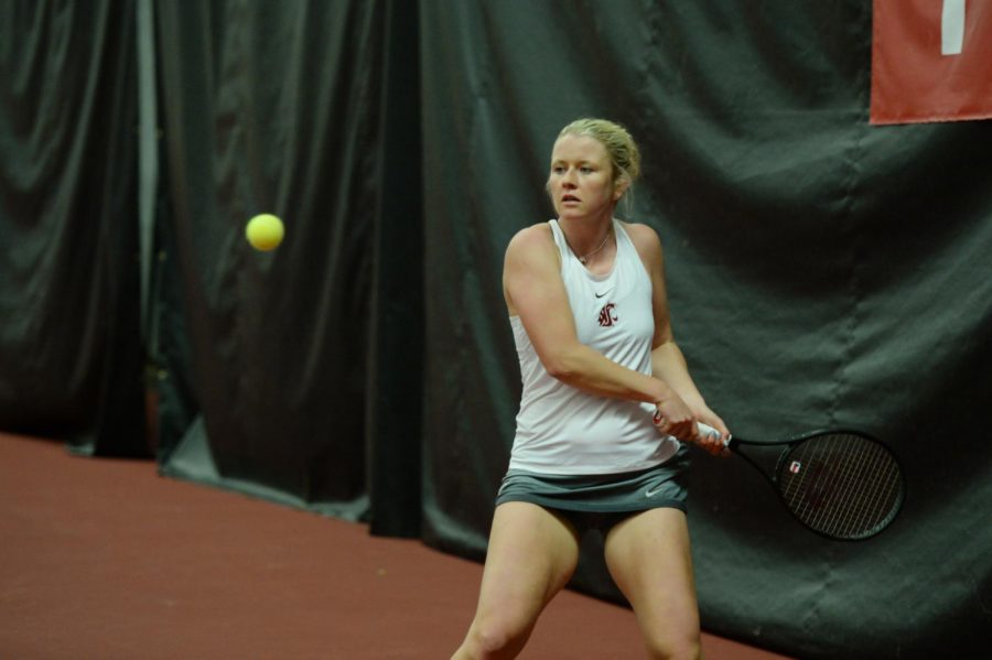 Senior+Aneta+Miksovska+watches+as+the+tennis+ball+approaches+before+volleying+back+to+Eastern+Washington+on+Jan.+12+at+Hollingbery+Fieldhouse.