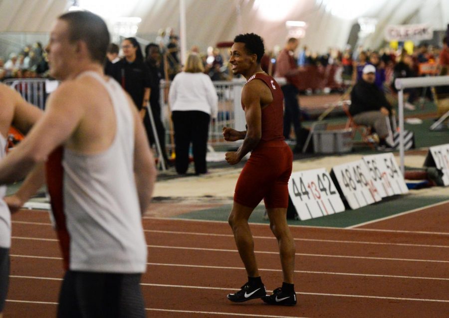 Junior Emmanuel Wells Jr. celebrates while looking up at the results board after sprinting a 6.69 second 60-meter dash to win the event, at the WSU Indoor meet Jan. 19 in the Indoor Practice Facility.