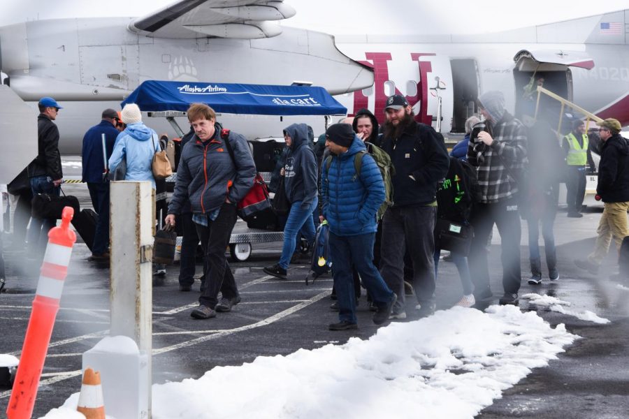Travelers exit an airplane Thursday at the Pullman-Moscow regional Airport. Employees are preparing to introduce TSA PreCheck as a temporary program, and those interested will be able to register at the fire station next to the airport from March 4-8 during specific times.