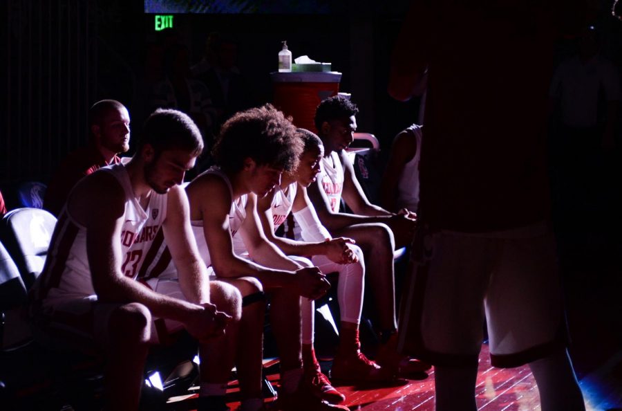 The starters for Saturday evening’s game sit on the edge of the court before they are announced before the game against USC at Beasley Coliseum. WSU will travel to Arizona for their next two contests.
