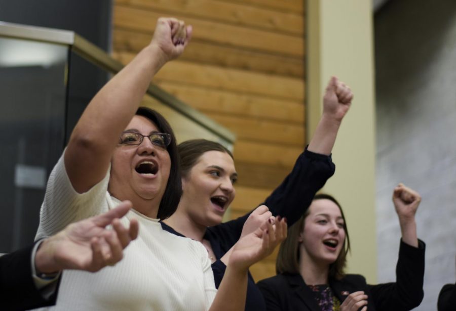 ASWSU members lead the fight song with Vice President of Student Affairs Mary Jo Gonzales to close their joint meeting with the Pullman City Council Wednesday night at the Elson S. Floyd Cultural Center.