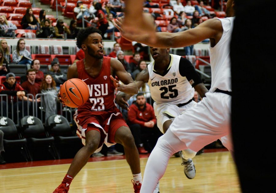 Junior point guard Ahmed Ali prepares to pass the ball during the WSU vs CU basketball game Feb. 20 night at Beasley Coliseum.