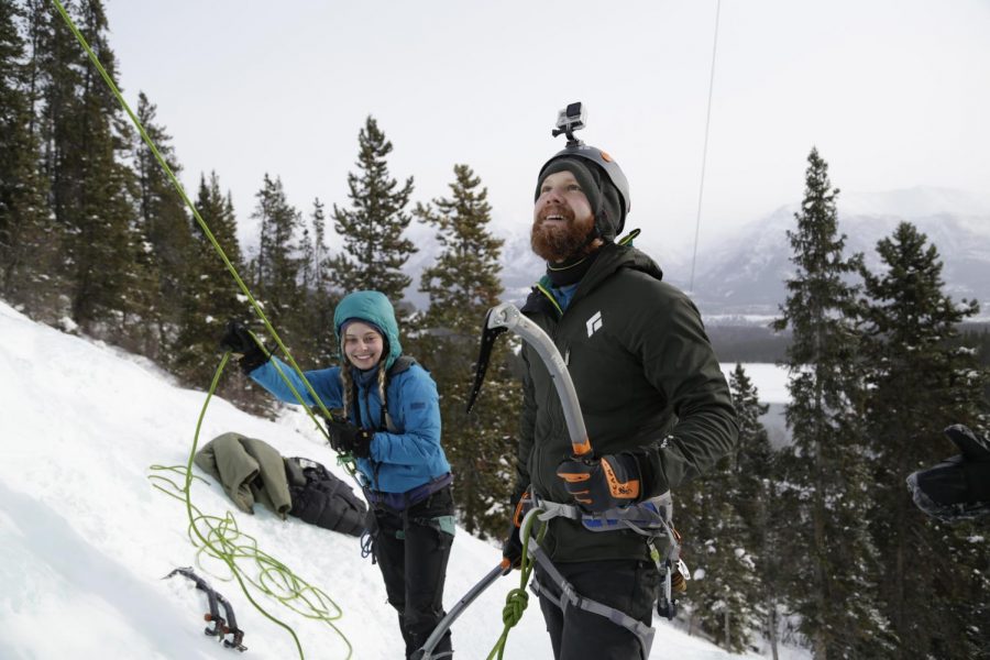Jacob Jones, right, a Whitman County news reporter, prepares to climb the 45-foot-tall ice sheet while Elise Bugge, WSU senior enviromental science major and an adventure facilitator at the Outdoor Recreation Center, belays him Saturday at the Canmore Junkyards in Alberta, Canada.  