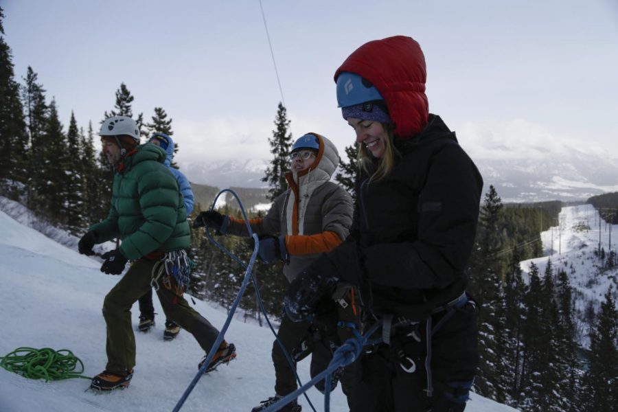 Hannah Kiser,right, an adventure facilitator at the Outdoor Recreation Center, prepares to climb as Wei Ching, middle, WSU second year Sports Management major, sets up to belay her Saturday at the Canmore Junkyards in Alberta, Canada.
