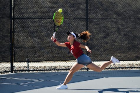 Then-freshman Savanna Ly-Nguyen reaches out to return the ball during her singles match against Arizona on Sunday at the WSU Outdoor Tennis Courts. The contest resulted in a 6-1 win for the Cougars.