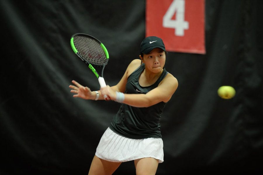 WSU Freshman Yang Lee returns a ball during singles play against Seattle U on Feb. 22 in Hollingbery Fieldhouse. Lee won her match in straight sets. Lee enjoys being a Cougar as well as spending time with her fun team.