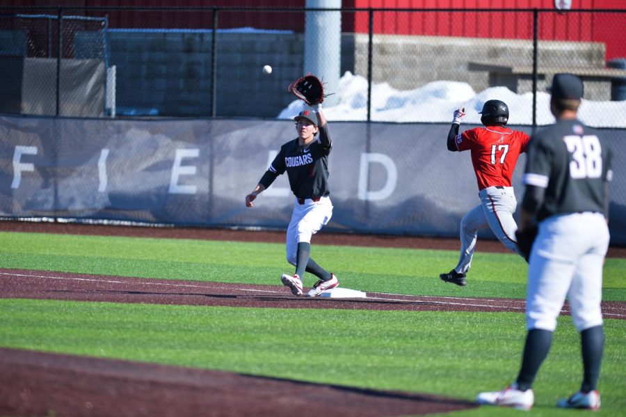 Junior infielder Dillon Plew catches a ball at first base in the game against Cal State Northridge on March 10 at Bailey-Brayton Field.
