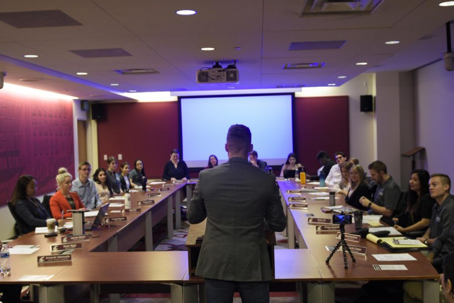 Keegan D. Otter, ASWSU director of community affairs, presents to the ASWSU Senate about downtown Pullman. Senators discussed a resolution to promote gender-neutral housing for all students on Wednesday night in the CUB.