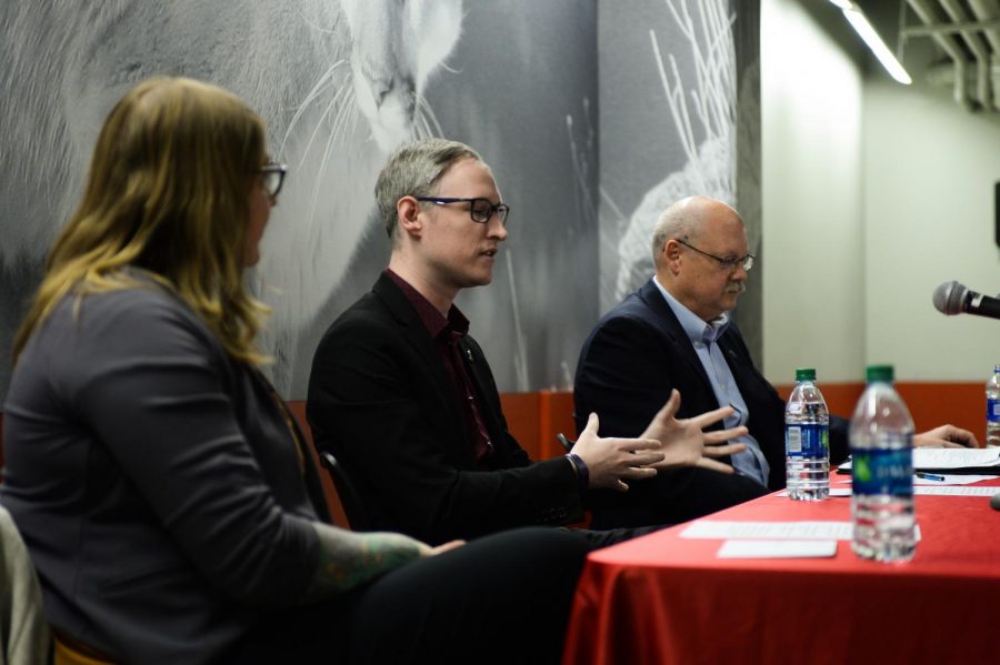 OEO Assistant Director Holly Ashkannejhad, left, sits Pullman Chief of Police Gary Jenkins, right, and criminal justice instructor Oliver Bowers, center, says he sees a lack of awareness of Title IX resources on campus during a panel Wednesday evening in the CUB. 