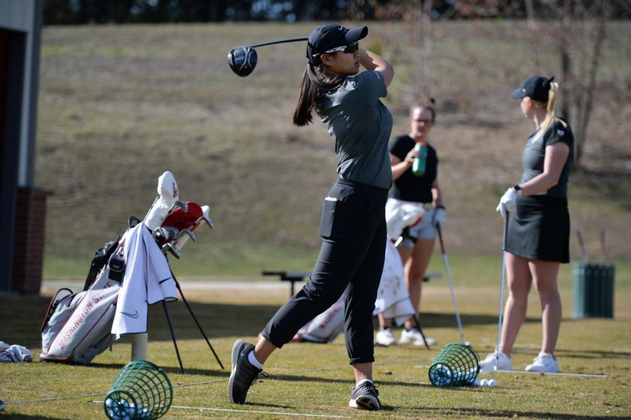 Freshman Amy Chu refines her driving skills along with teammates Madison Odiorne and Emily Baumgart during a practice session April 1 at WSUs practice facility.