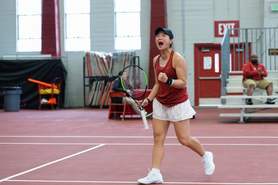 Freshman Yang Lee celebrates after winning a set during her match against USC on April 14 in Hollingbery Fieldhouse.