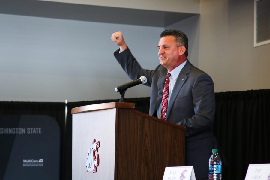 The new mens basketball head coach, Kyle Smith, gives a Go Cougs at the introductory press conference in the Rankich Club Room of Martin Stadium on Monday morning.