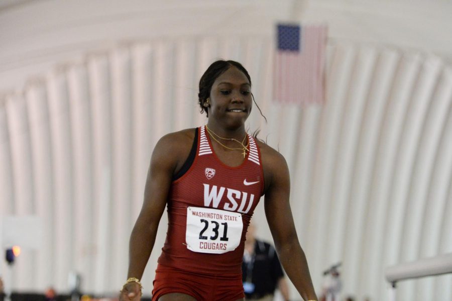 Freshman Charisma Taylor walks out of the pit after competing in the long jump at the WSU Indoor Meet on Jan. 19 at the Indoor Practice Facility. Taylor placed second in the meet with a jump of 5.77 meters.
