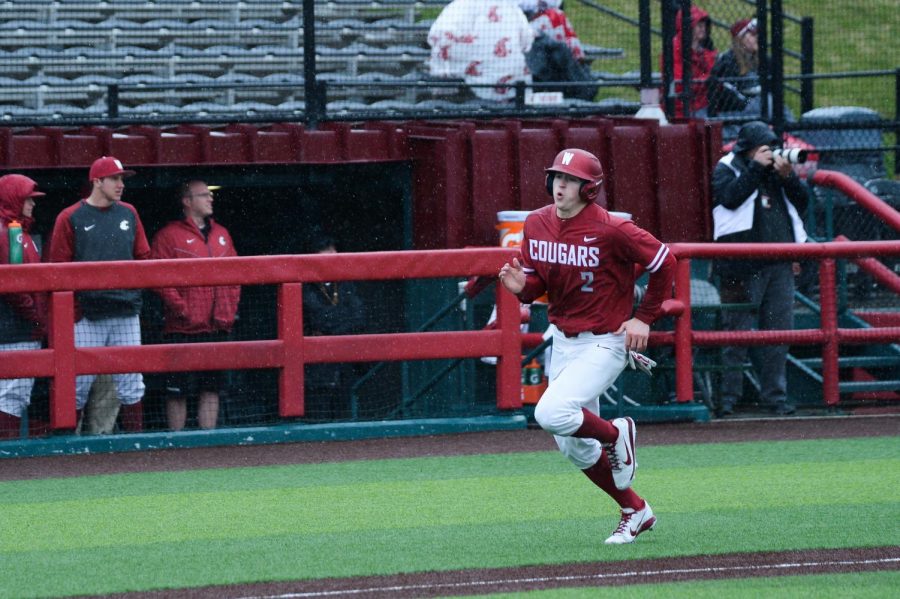 Junior outfielder Danny Sinatro runs home during the game against Oregon on Saturday at Bailey-Brayton Field.
