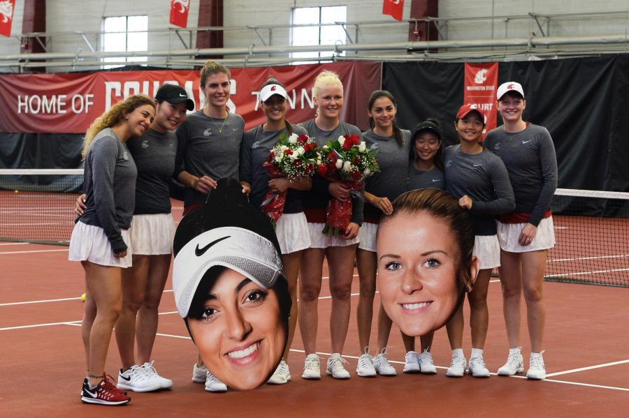 The WSU Womens Tennis team gathers for a group photo to celebrate senior day before their match against the University of Washington on Saturday afternoon at the Hollingbery Fieldhouse. 