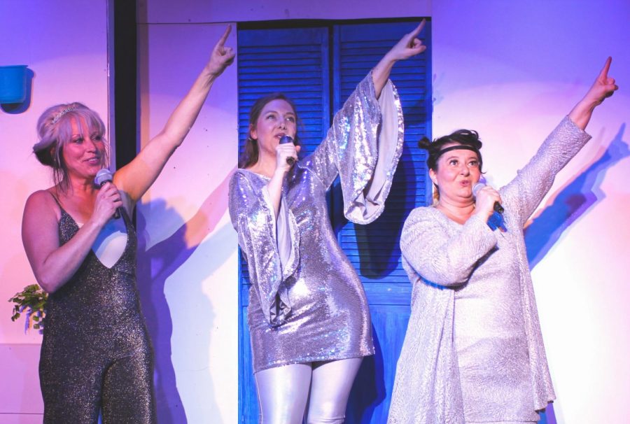 Local actors from the “Mamma Mia!” cast at the Regional Theatre of the Palouse perform a song in costume. The critically acclaimed Broadway musical is showing at RTOP in downtown Pullman from April 3 until April 14. 