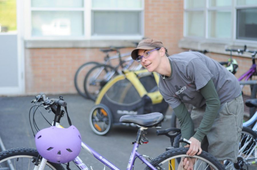 Volunteer bike mechanic Jen Jackson performs inspections on bikes at Moscow Middle School on National Bike to School Day on Wednesday. 