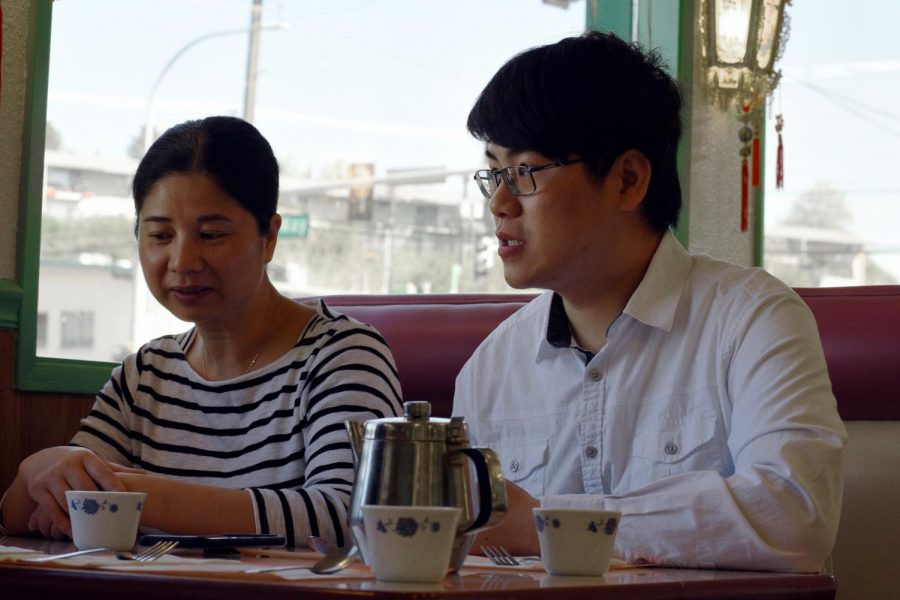 Restaurant owner Yu Kuang and his mother Bixia Kuang discuss the history of their business May 11 at the Emerald Chinese Restaurant.