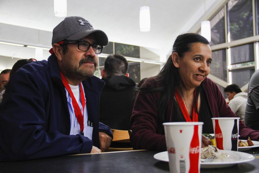 Martin Arreola, an apple orchard manager, and his wife Luz talk about La Bienvenida during one of the events dinners on Friday at Southside Cafe.
