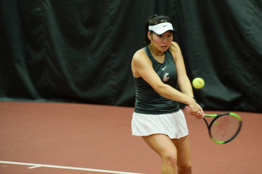 WSU+Senior+Hikaru+Sato+returns+a+ball+during+doubles+play+against+Seattle+U+in+Hollingbery+Fieldhouse+on+Friday+Feb.+22+.+Sato+and+teammate+Tiffany+Mylonas+had+their+match+conclude+3-4+once+WSU+clinched+the+doubles+point.