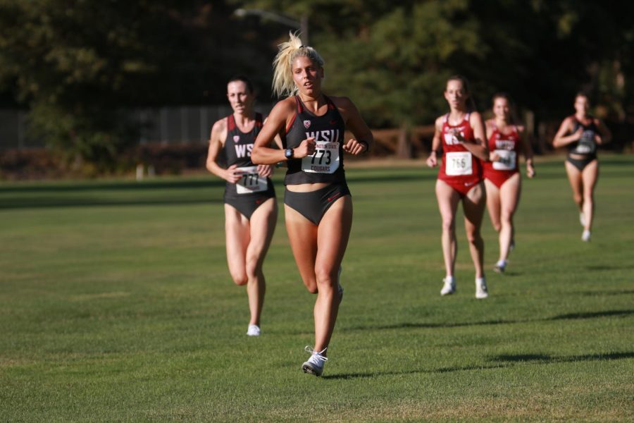 Sophomore Zorana Grujic leads the gray team in the first 2,000m of the 2019 WSU XC Open on Friday evening at Colfax Golf Course.