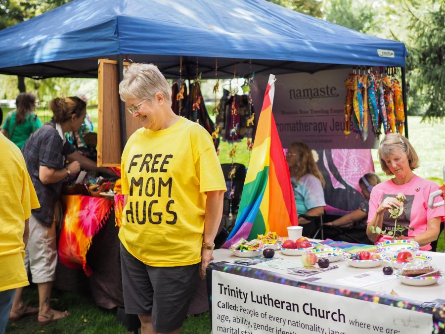 Ruth Nice, member of the Trinity Lutheran Church, offers free mom hugs at a booth at Palouse Pride on Friday.