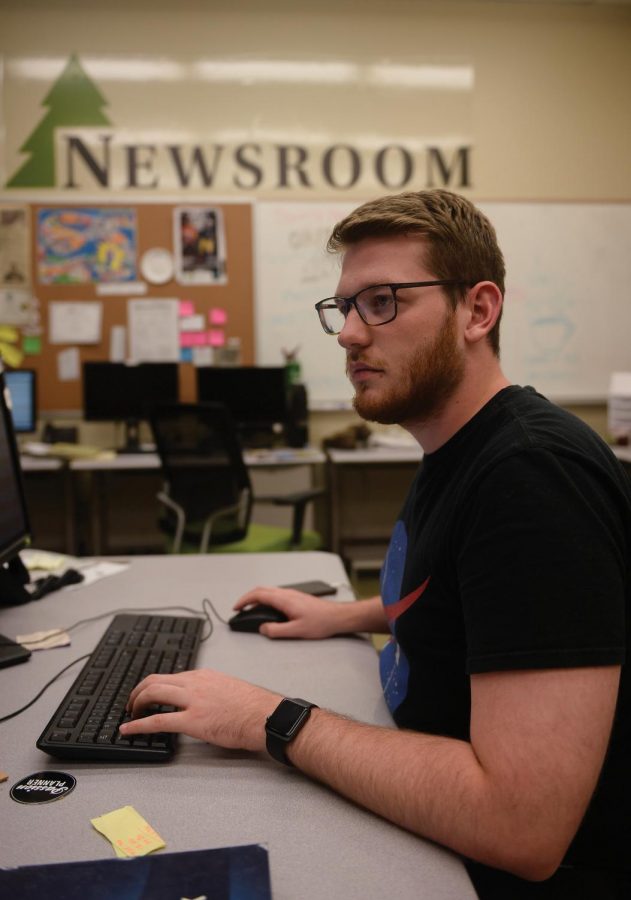 Life+Editor+Zach+Goff+finishes+laying+out+his+pages+during+production+on+Wednesday+in+the+Evergreen+newsroom.
