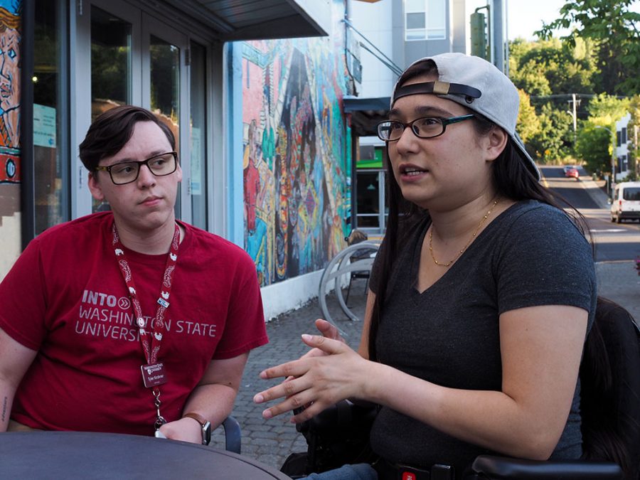Student services coordinator Tyler Kirshner, left, listens as Acacia Kapusta, former outreach and education coordinator for the Office of Outreach and Education, discusses the Disabled Staff and Faculty + Allies Affinity Group on Monday at Thomas Hammer Coffee Roasters.