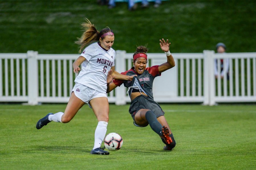 Then-freshman defender Mykiaa Minniss slides while fighting for the ball against the Montana Grizzlies on Sept. 14 at the Lower Soccer Fields.