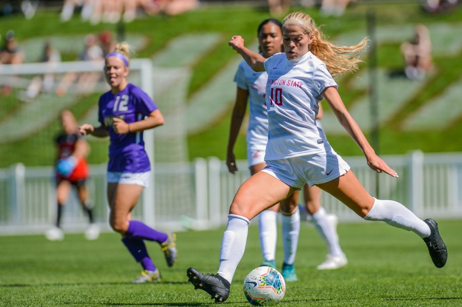 Junior defender Brianna Alger dribbles up the field after taking the ball from James Madison University’s forward Aug. 31 at the Lower Soccer Field.