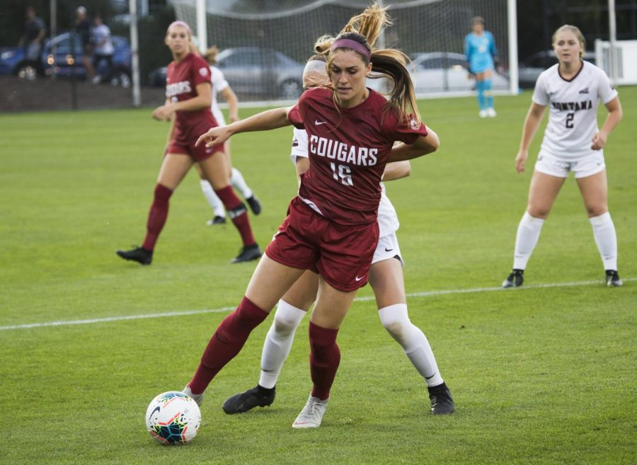 Graduate midfielder Averie Collins protects the ball from a Montana player during the game on Aug. 30 at the Lower Soccer Field. 