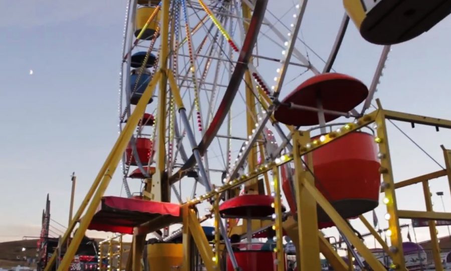 Visitors ride on the ferris wheel at the Palouse Empire
Fair.