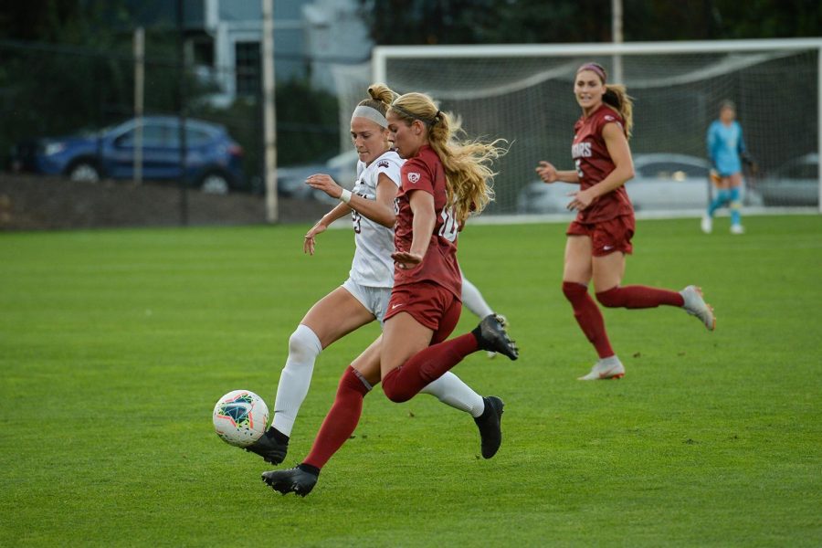Junior defender Brianna Alger fights for the ball with red-shirt sophomore Montana forward Rita Lang on Aug. 30 at the Lower Soccer Field in Pullman. 
