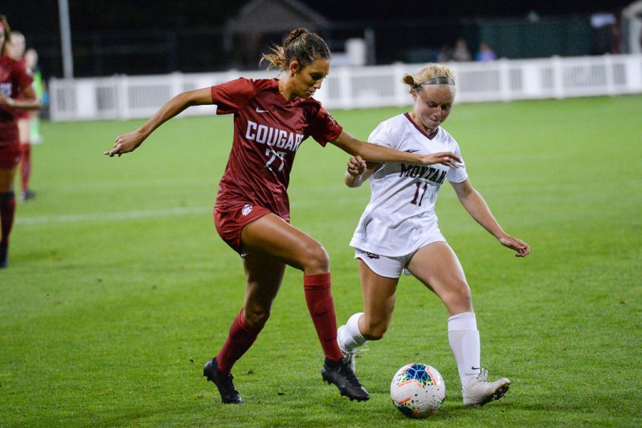 Freshman defender Sophie Dimry protects the ball from Montana freshman midfielder Quinn Peacock.