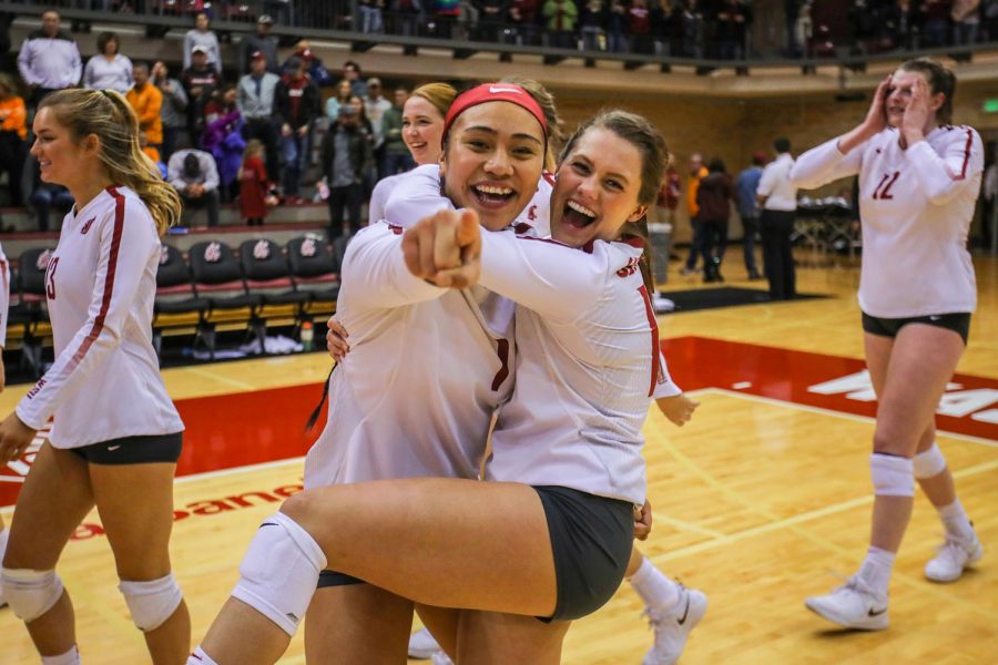 Then-sophomore outside hitter Penny Tusa and then-senior defensive specialist Abby Phillips celebrate after the win against the University of Tennessee on Dec. 1, 2018, in Bohler Gym.
