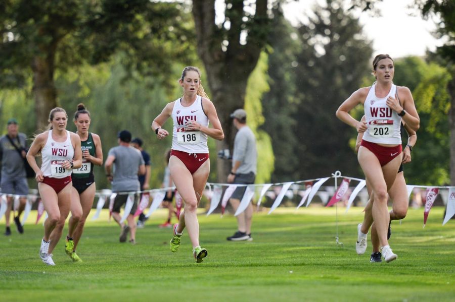 Melissa Hruska, Kiyena Betty, and Marie Gaudin run together during the womens race on Friday at the Colfax Golf Club in Colfax, WA.