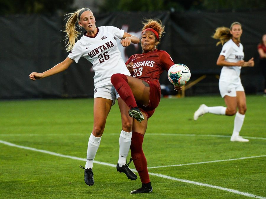 Sophomore defender Mykiaa Minniss defends the ball from Montana sophomore midfielder Zoe Transtrum during the game against University of Montana on Aug. 30 at the Lower Soccer Field. 