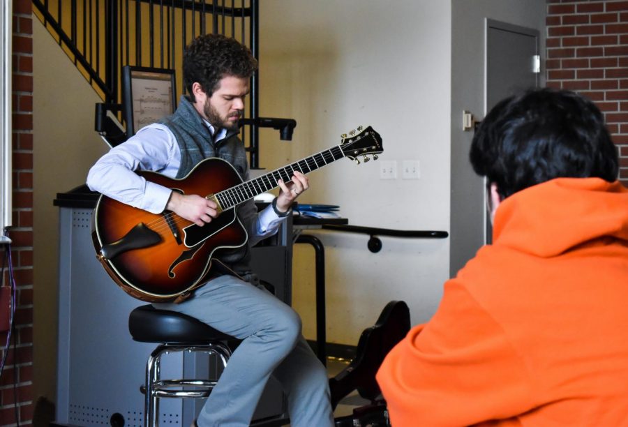 Gabriel+Condon%2C+instructor+of+classical+and+jazz+guitar%2C+plays+a+song+for+his+students+at+the+beginning+of+his+Music+120+class+September.+2019+morning+in+Kimbrough+115.+