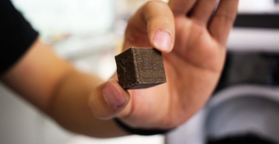 Researchers created a small cube out of plastic and coffee grounds to test its strength. They found that it is tougher if coffee grounds took up 20 percent of the material.