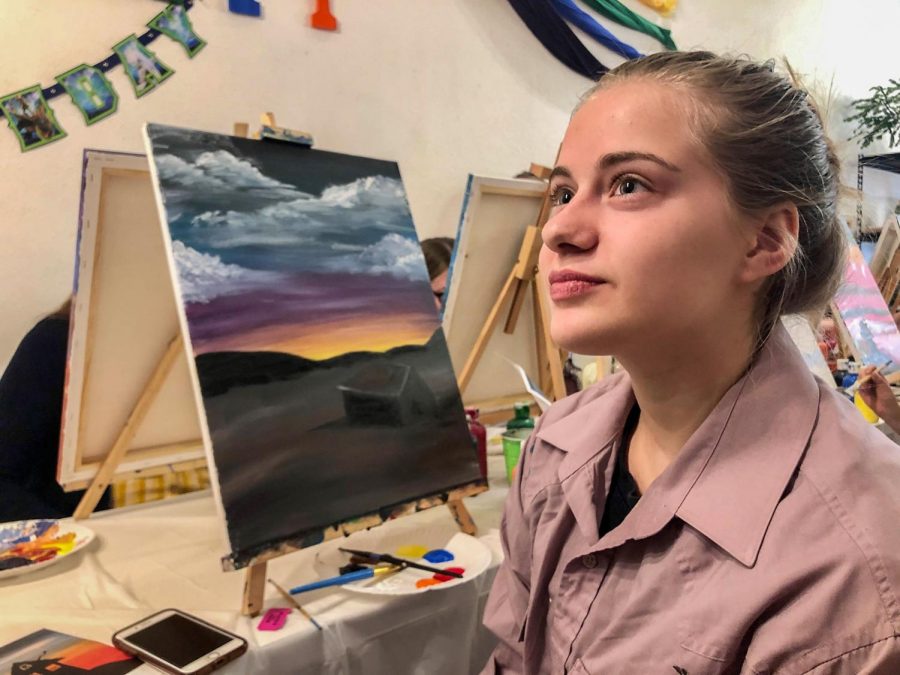 Julia Branen, 16, captures the attention of many attendees with her beautiful paint work,. She claims that she draws in her free time but rarely plays with paint on Saturday morning, at the Moscow Wild at Art.