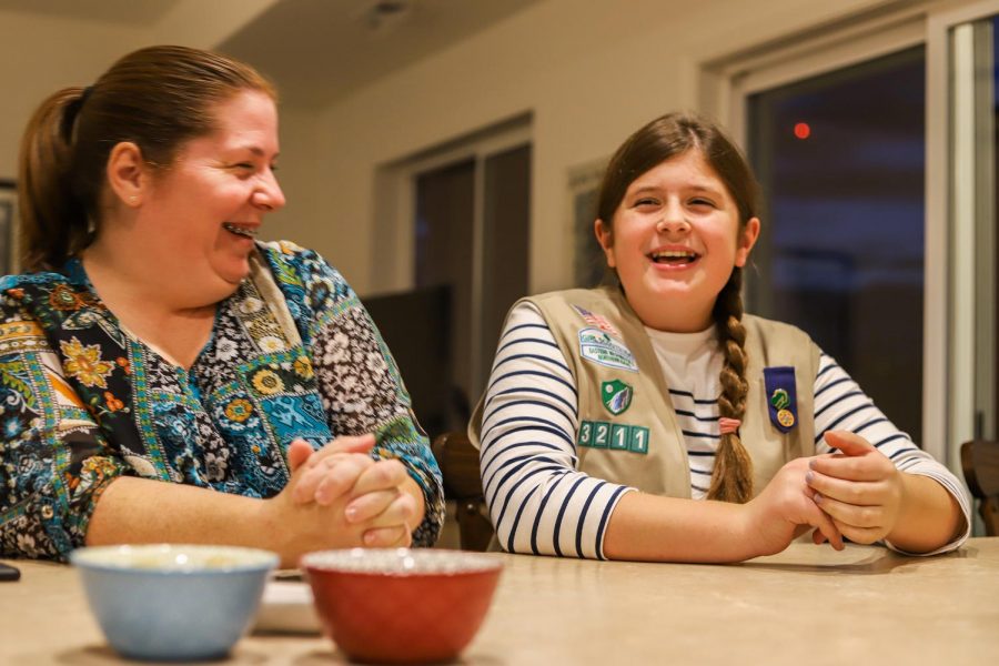 Deidrea Power-McEwen and 11-year-old Claire McEwen talk about the Girl Scout Cookie selling process Monday evening in their home. “Sometimes loving your product makes it easier to sell it,” Claire said.
