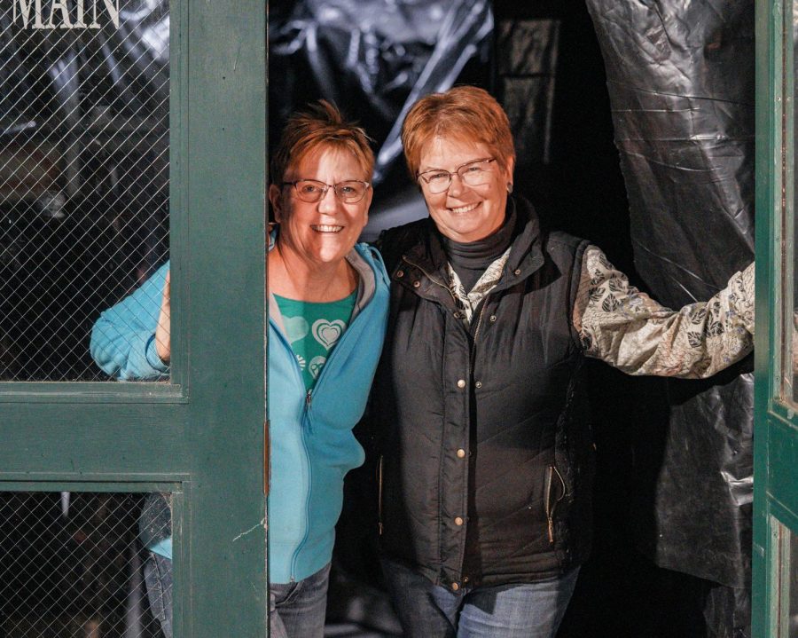 Board President Paula Echanove and Co-chair Janet Barstow pose in front of their unfinished haunted house Tuesday night in the Palouse. “We know exactly what we need,” Echanove said.