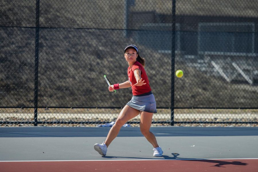 Then-freshman+Savanna+Ly-Nguyen+hits+the+tennis+ball+back+towards+her+opponent+on+Mar.+31+at+the+Outdoor+Tennis+Courts.+The+game+against+Arizona+resulted+in+a+6-1+win+for+the+Cougars.