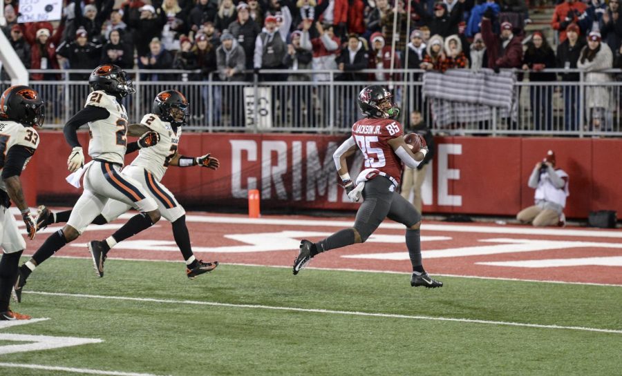 Senior wide receiver Calvin Jackson Jr. looks back at it while striding away from the Oregon State defense and into the endzone for a touchdown Saturday evening in Martin Stadium.