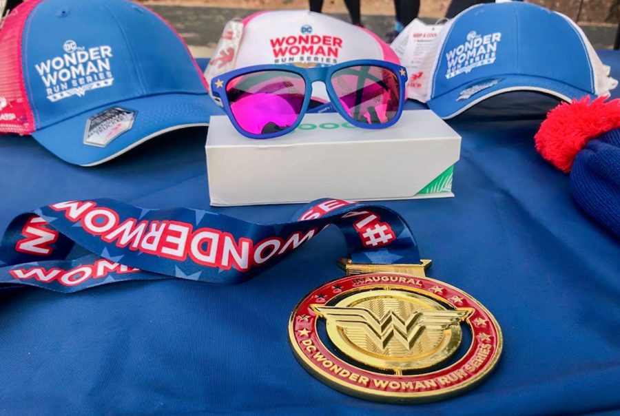 Everyone who participated in the Wonder Woman College Campus 5K run recieved a medal and could purchase other themed items Saturday morning at the Outdoor Recreation Center.