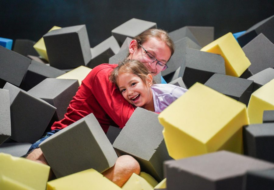 Brother Garen Growing Thunder and sister Laren Paul play around in the foam pit Monday night at Planet 3 Extreme Air Park. The nonprofit Families Together was created to provide support to parents who have children with disabilites.