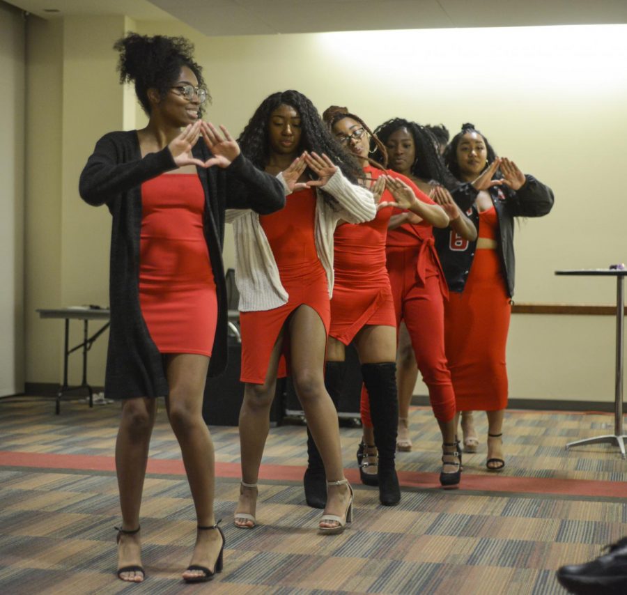 Members of the Xi Psi chapter of Delta Sigma Theta Sorority, Inc. stroll at the African Violet Talent Showcase before intermissions Friday night at the CUB Jr. Ballroom.